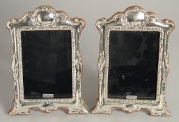 A PAIR OF SILVER PHOTOGRAPH FRAMES 7ins high.