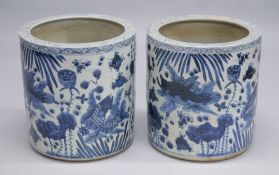 A PAIR OF CHINESE BLUE AND WHITE POTTERY GARDEN JARDINIERES. 1ft 8ins high.