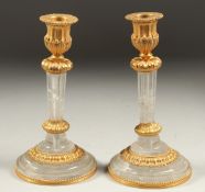 A GOOD PAIR OF ROCK CRYSTAL CANDLESTICKS 7.5ins high.