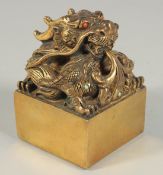 A HEAVY CHINESE BRONZE SQUARE DRAGON SEAL 5.5ins high.