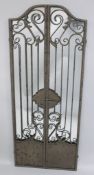 A WROUGHT IRON FOLDING GARDEN MIRROR. 4ft 11Iins X 2ft (closed).
