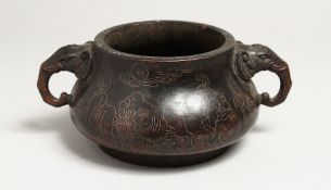 A GOOD CHINESE CIRCULAR BRONZE TWO HANDLED CENSER with elephant handles and inlaid with silver. 6.