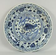 A LARGE CHINESE BLUE AND WHITE MING DESIGN CIRCULAR PATTERN decorated with a fish and flower