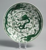 A CHINESE FAMILLE VERTE PORCELAIN DISH, decorated with dragons and the flaming pearl of wisdom