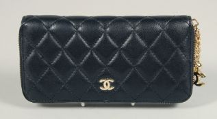 A CHANEL PADDED LEATHER PURSE, No. 10218184, with a gilt hinge. 7.5ins x 3.5ins.