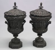A GOOD PAIR OF CLASSICAL STYLE CARVED WOOD TWIN HANDLED PEDESTAL URNS. 2ft 10ins high.