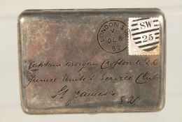 A VICTORIAN SILVER CIGARETTE CASE engraved as a letter with Victorian Stamp. 3.75ins x 2.75ins.