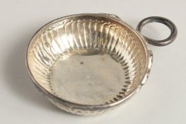 A FRENCH SILVER WINE TASTER 3ins diameter.