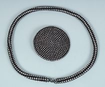 A YVES SAINT LAURENT DIAMOND BLACK BELT.