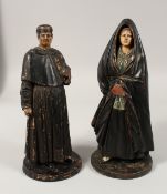 A RARE PAIR OF 19TH CENTURY PORTUGUESE FIGURES OF A MAN AND A WOMAN. 16ins high.