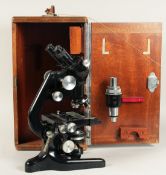 A WATSON BACTIL BINOCULAR TELESCOPE. No. 121155. 14ins high in a mahogany case.