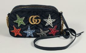 A GUCCI BLACK VELVET LTD. EDITION STAR BAG. 9.5ins x 5ins with a double 'G' and six coloured