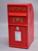 A RED POST BOX 25ins high, 12ins deep.
