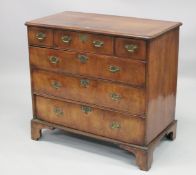 AN 18TH CENTURY WALNUT CHEST OF DRAWERS with a moulded top, three small drawers above three