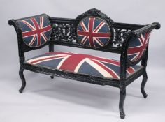 A VICTORIAN STYLE BLACK PAINTED SCROLL END SETTEE, upholstered with a Union Jack fabric. 5ft long