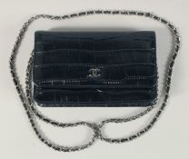 A CHANEL CROCODILE SKIN BLACK JUMBO HANDBAG. No, 19172011 7.25ins x 4.25ins