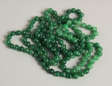 A LONG JADE NECKLACE.