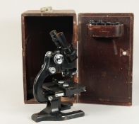 A SPENCER BUFFALO USA BLACK PAINTED MICROSCOPE. No. 162440. 12ins high in a mahogany case.