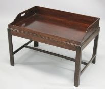 A 19TH/ 20TH CENTURY MAHOGANY BUTLERS TRAY on stand. 2ft 10ins long x 1ft 1.0.5ins wide x 1ft