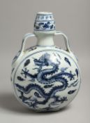 A CHINESE BLUE AND WHITE MOON FLASK decorated with a dragon. 11.5ins high x 7.5ins diameter.