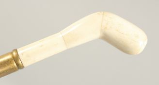 A WALKING STICK with carved bone handle 'CLUB'. 3ft 3ins long.