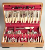 AN EIGHT PIECE SILVER CANTEEN comprising tablespoons, dessert spoons, soup spoons, teaspoons,