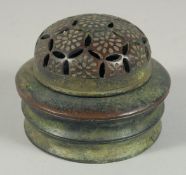 A CHINESE JADE CIRCULAR CENSER with pierced lid. 4.5ins diameter.