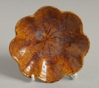 A CHINESE YELLOW POTTERY DISH. 3.75ins