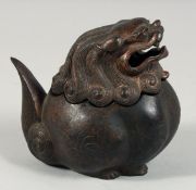 A CHINESE BRONZE BULBOUS LION DOG LIDDED CENSER, with traces of gilt and red paint, the head as a