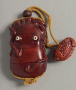 A WOODEN OCTOPUS INRO with rope. 3.5ins.