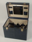 A BLUE LEATHER VANITY CASE.