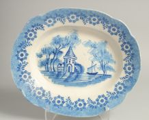 A BLUE AND WHITE OVAL METAL PLATE with a building and a ship. 14ins long.