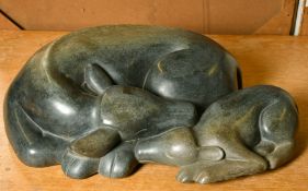 Ronnie Dongo (b.1967) A carved stone sculpture of a cow and calf, signed, 7