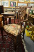 A set of five Chippendale style mahogany dining chairs, one with arms (two lacking seats).
