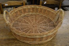 A wicker twin handled basket.