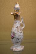 A French gilt decorated porcelain ewer and stopper.