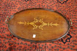 A mahogany and inlaid oval twin handled tray.