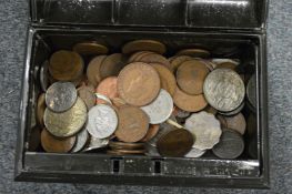 A small tin of assorted coins.