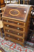 A small Edwardian inlaid mahogany bureau.