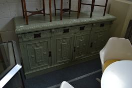 A pale green painted Victorian sideboard.