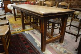 An oak refectory style dining table.