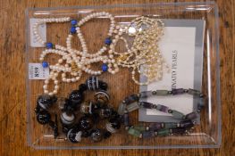 Pearl necklaces and two decorative bead necklaces.