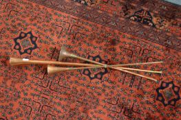 Three copper hunting horns.