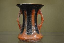 A lustre decorated twin handled vase.