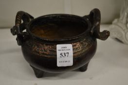 A cast bronze Chinese censor.