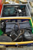 Two boxes of cameras and camera equipment.