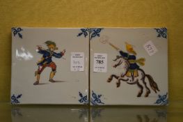 A pair of delft tiles.