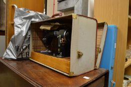 A sewing machine and a knitting machine with accessories.