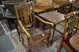 An oak carver chair and an occasional table.