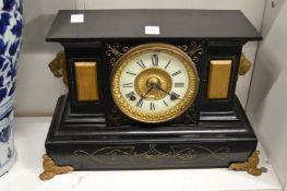A Victorian mantel clock.